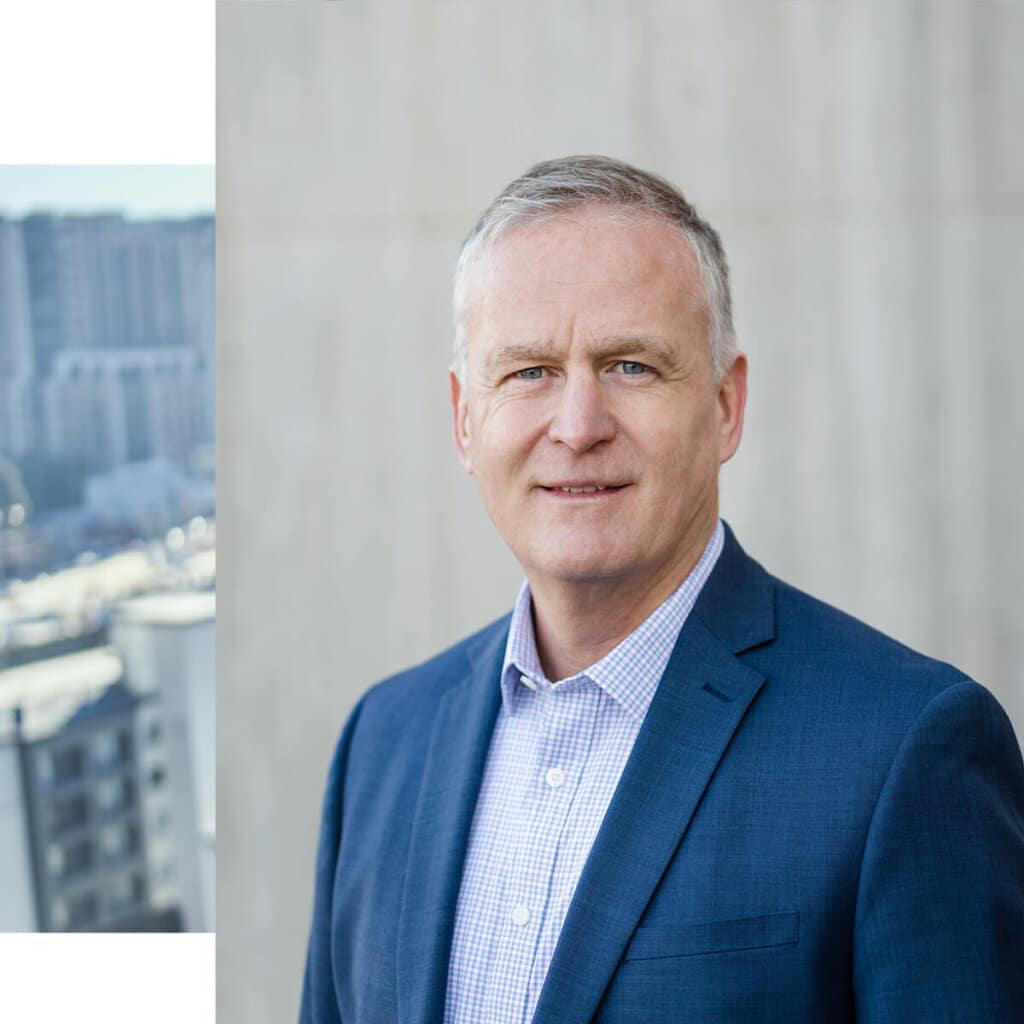 financial advisor in blue suit looking at camera