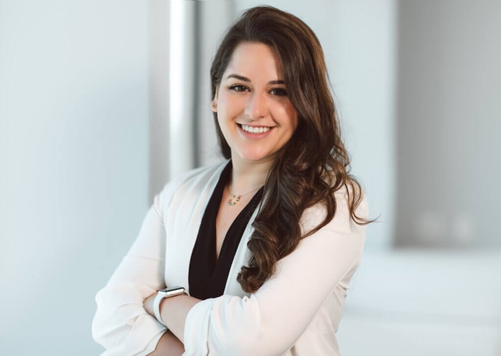 female financial advisor smiling dressed professionally