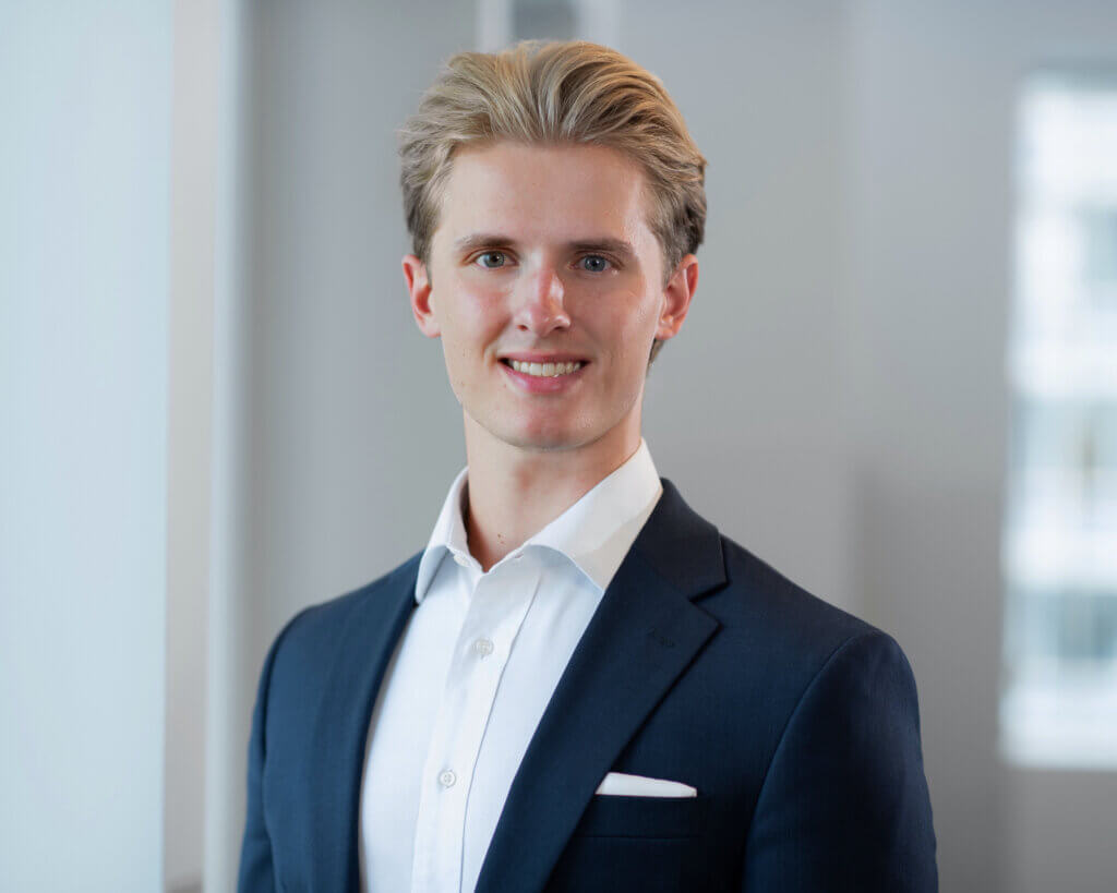 man in blue blazer with white button down shirt